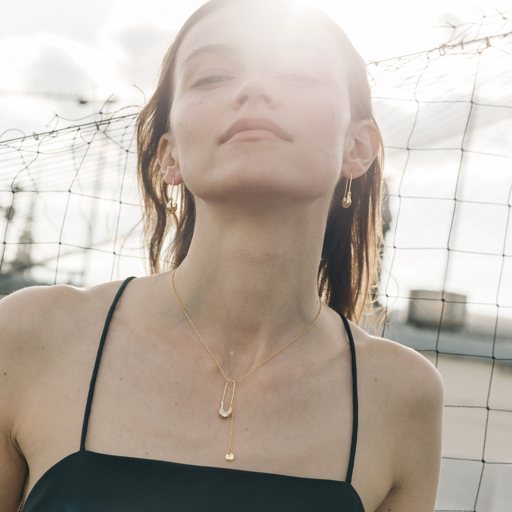 
                  
                    Gold-plated Pin Necklace with Crystals
                  
                